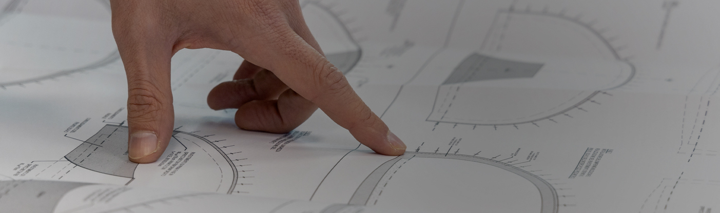 Hand consulting a technical document